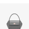 Soft cow leather wing-shaped tote handbag with a buckle and cross-body strap in four colour options.