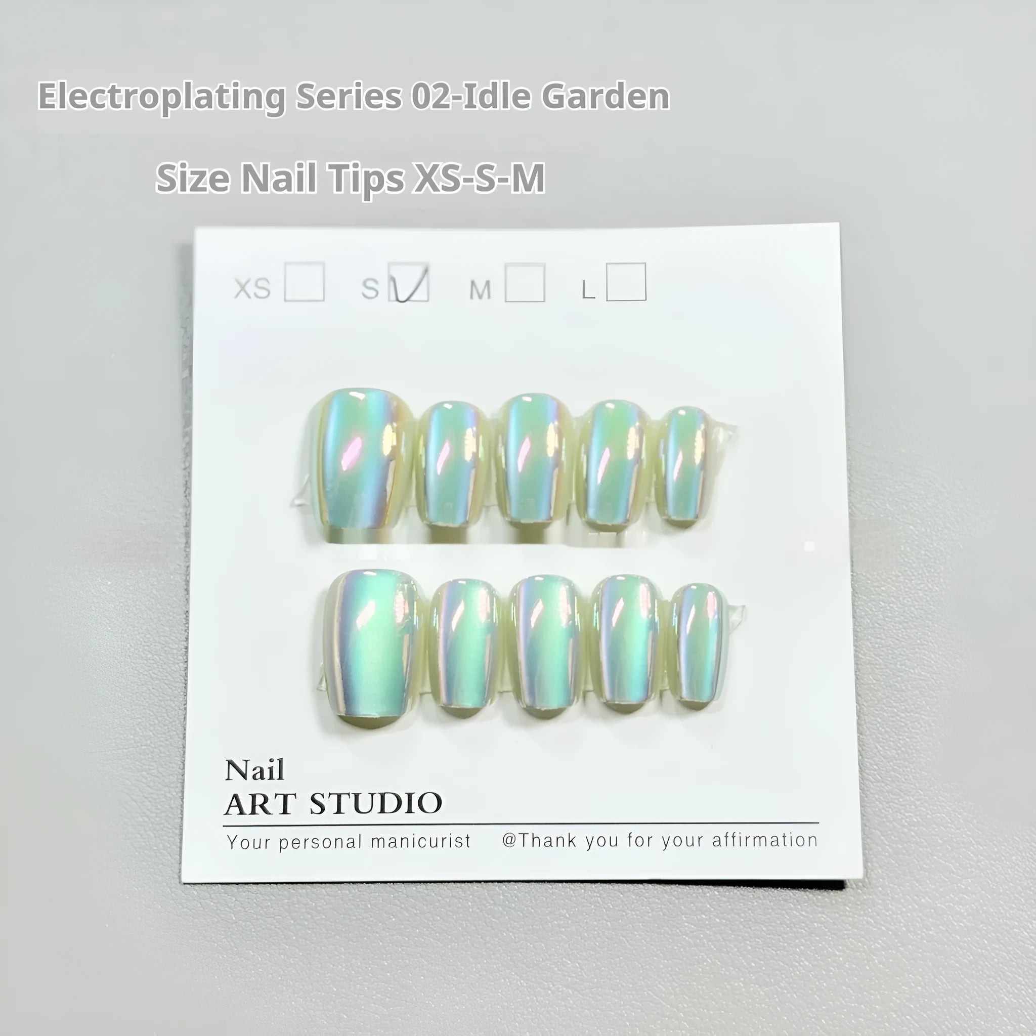 Electroplated Cat's Eye press-on nails with Aurora armour finish in short ladder XS, S, and M sizes