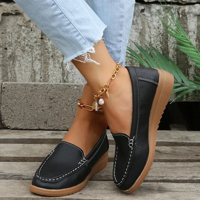 Women's flat loafer shoes in PU leather with a round toe and rubber sole, shown in multiple colours.