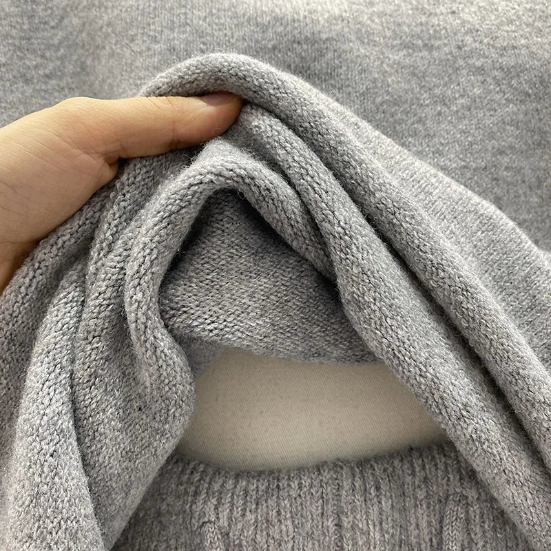 Women's loose grey knitted sweater and wide leg shorts two-piece loungewear set.