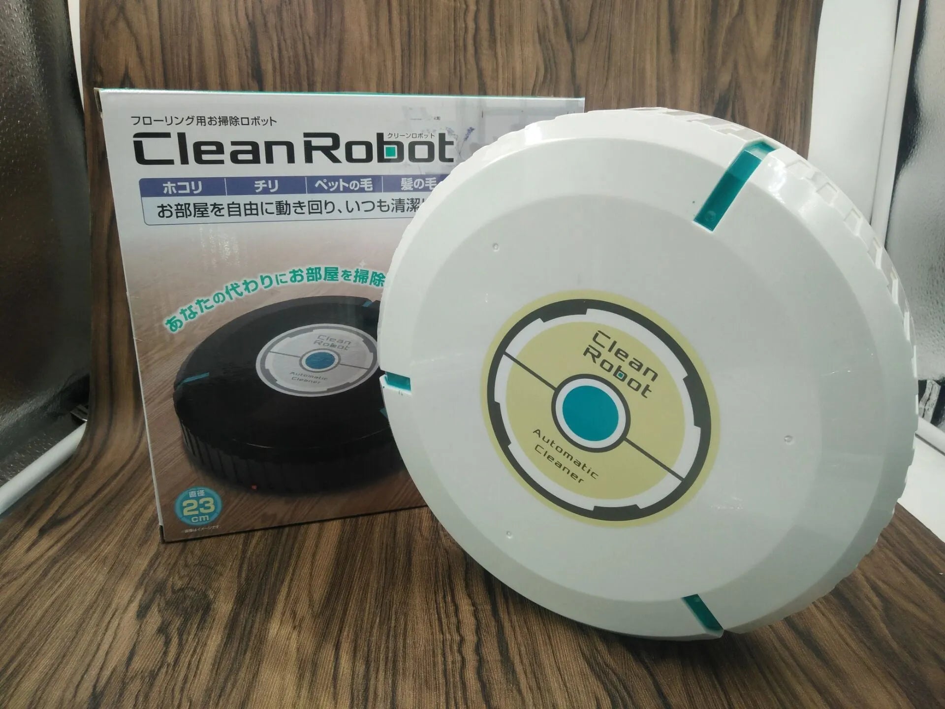 Black or white square robot vacuum cleaner with low 6cm profile for under furniture.