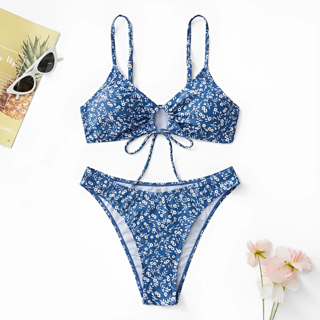 Blue three-piece polyester swimsuit set with top and shorts on a mannequin.