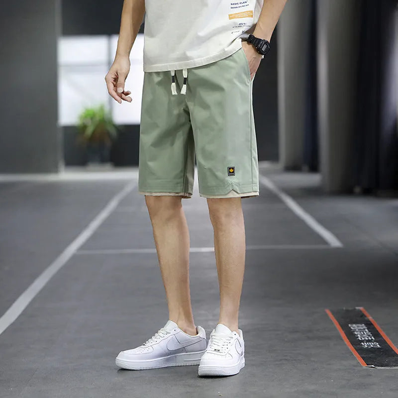 Men's loose fit straight leg beach shorts in various colours with elastic waistband