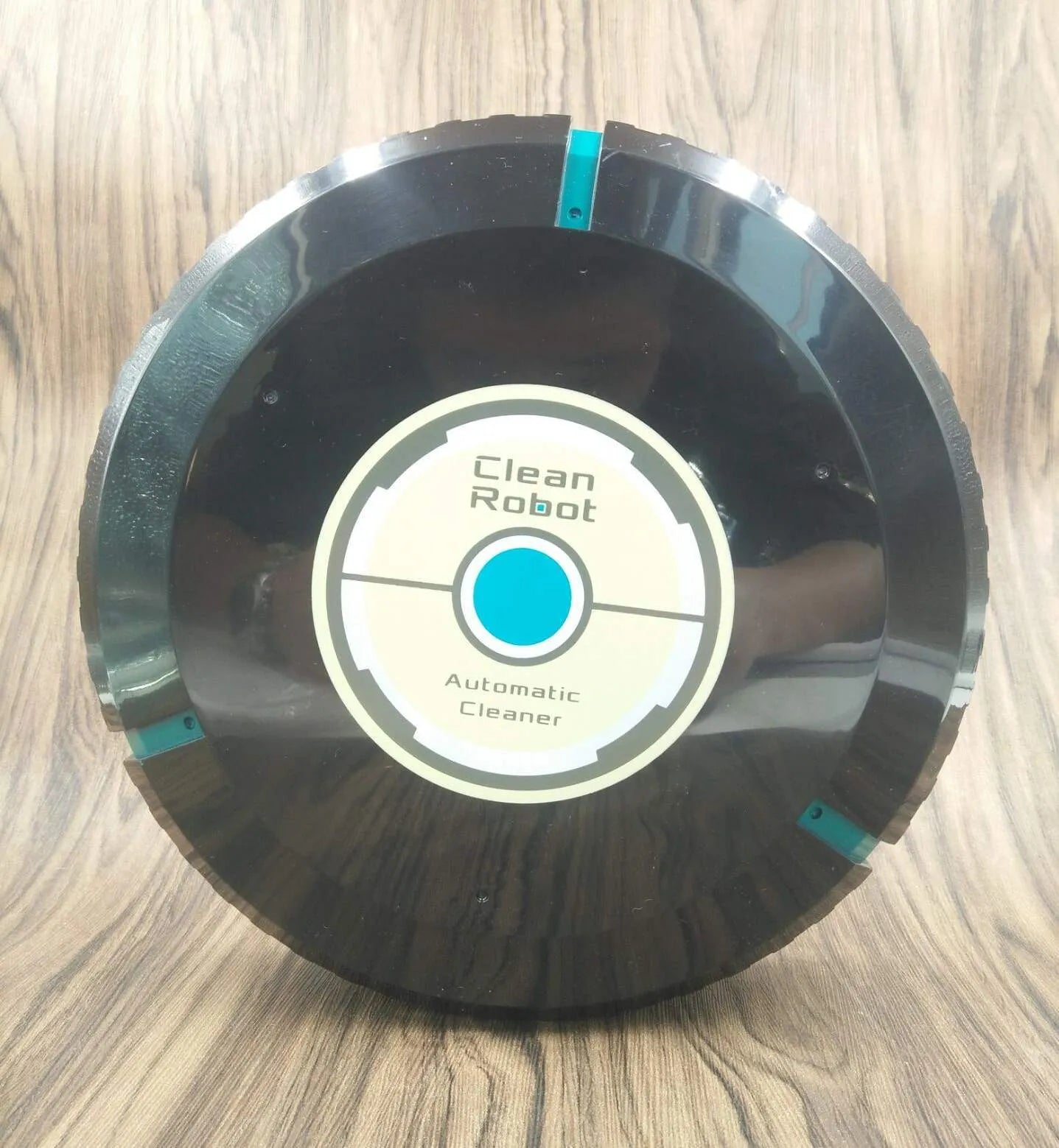Black or white square robot vacuum cleaner with low 6cm profile for under furniture.