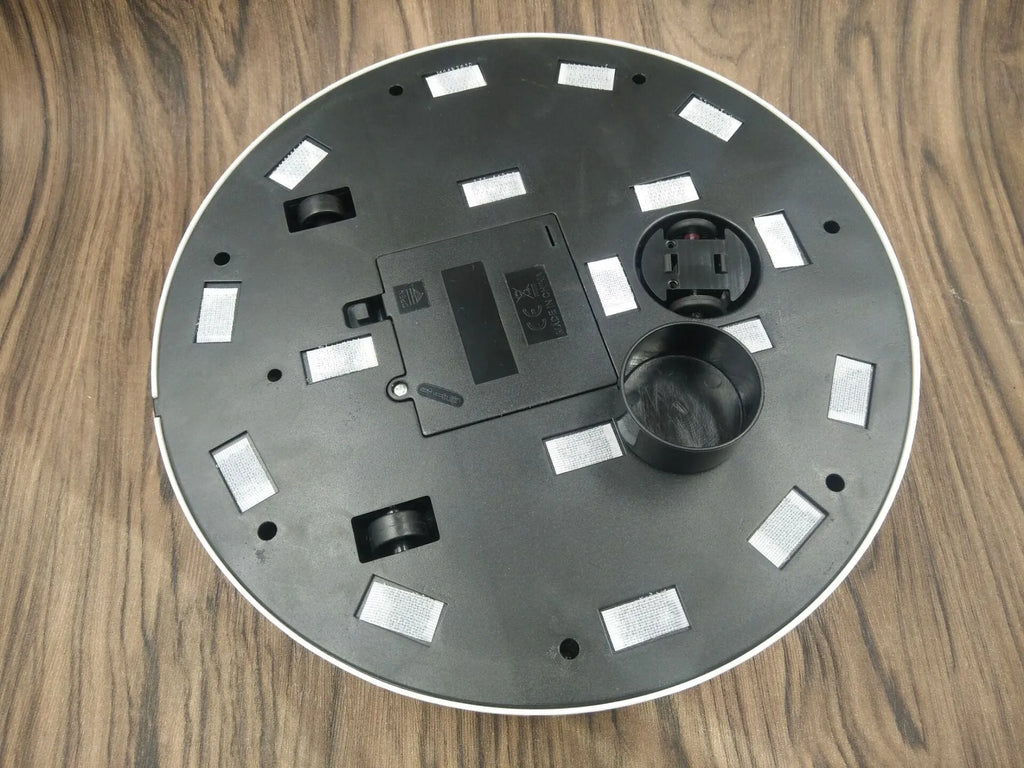 Black or white square robot vacuum cleaner with low 6cm profile for under furniture.