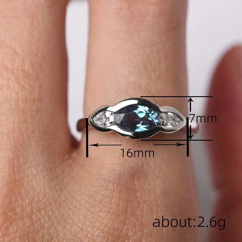 Geometric ellipse women's ring with inlaid zircon stones in Q941 white gold finish