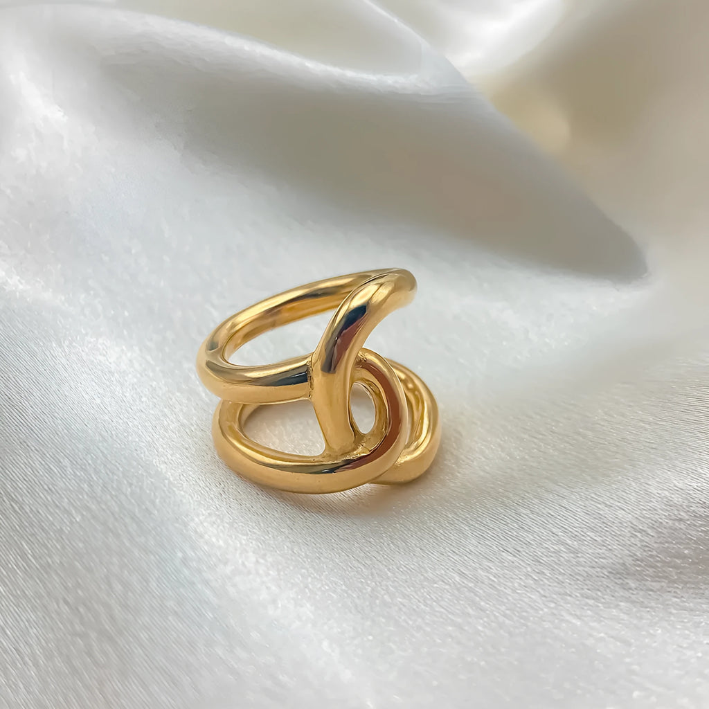 Adjustable opening ring with knotted geometric design in stainless steel gold or steel colour