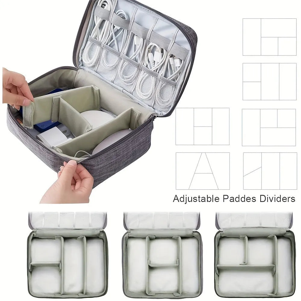 Black waterproof travel cable organiser bag open to show removable dividers and mesh pockets for electronics.