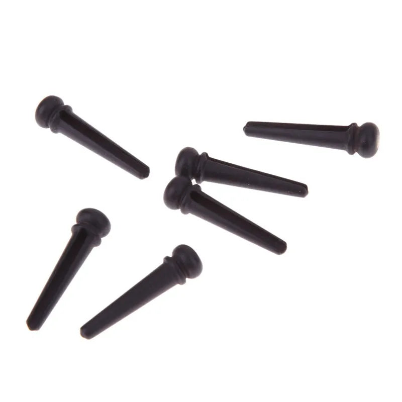 Six ebony folk guitar string nails with matt black finish for acoustic guitar bridge