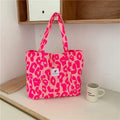 Large capacity oxford cloth women's shoulder bag with a three-dimensional front pocket.