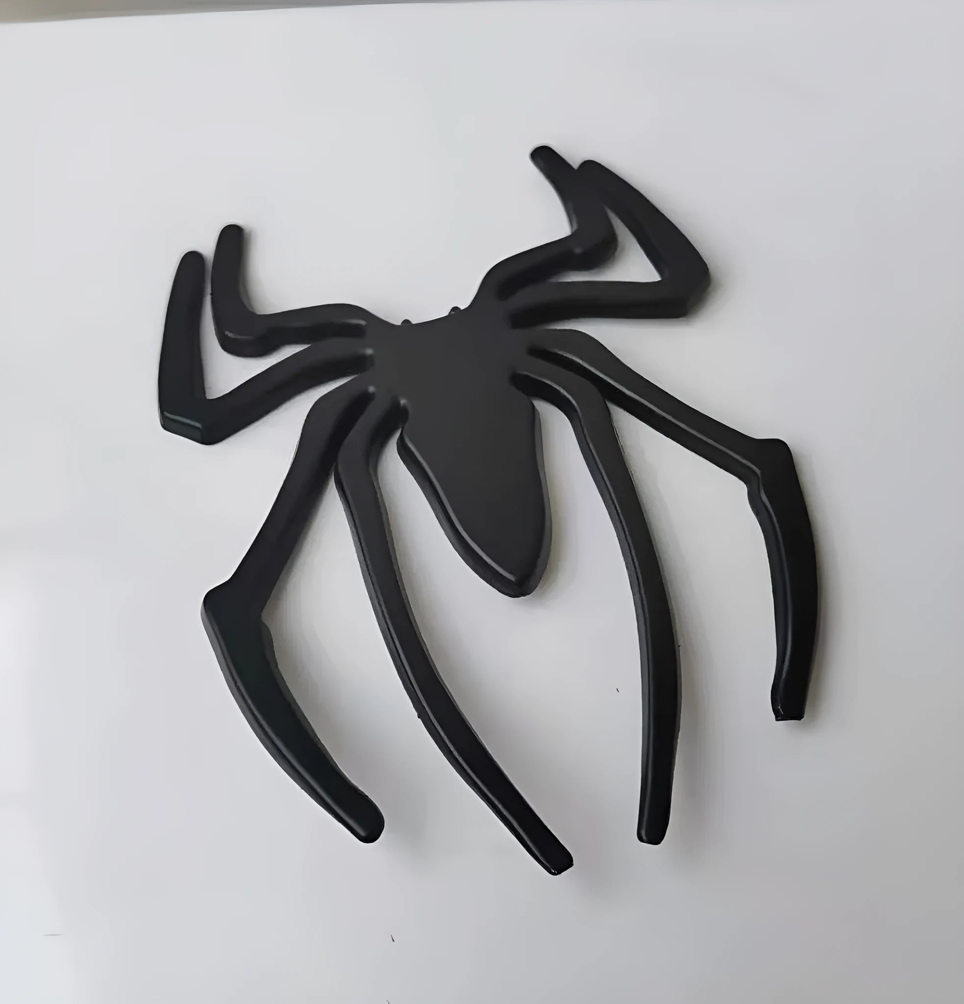 Gold zinc alloy metal spider decorative sticker on a white background