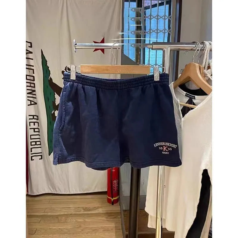 Women's dark blue cotton sports shorts with white flag embroidery design