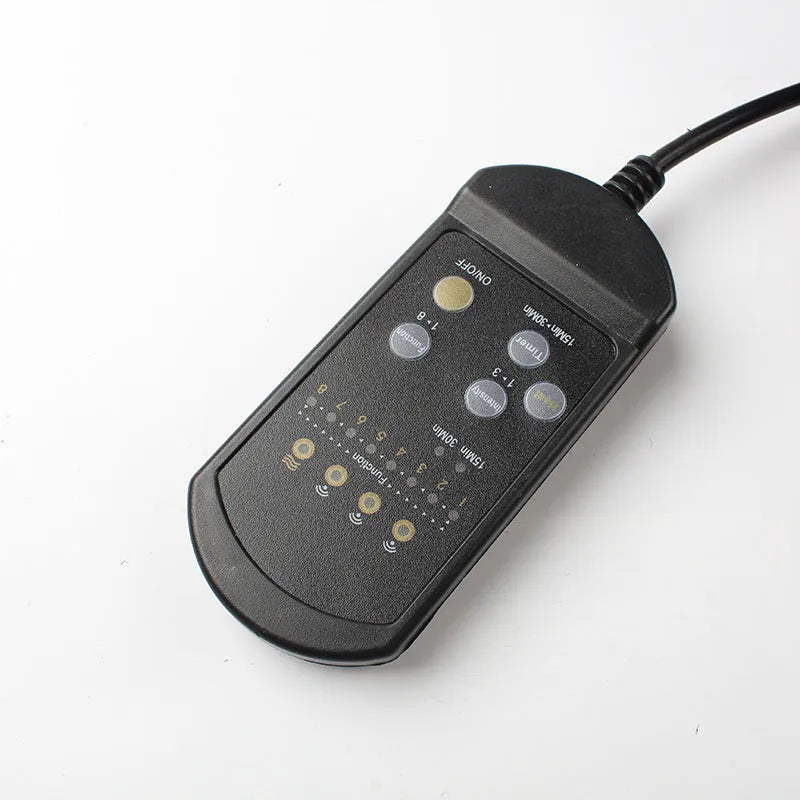 Black infrared heating massage mat with a separate seat cushion on a grey background