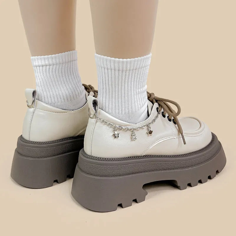 White Mary Jane platform shoes with chunky heel and front lace-up fastening