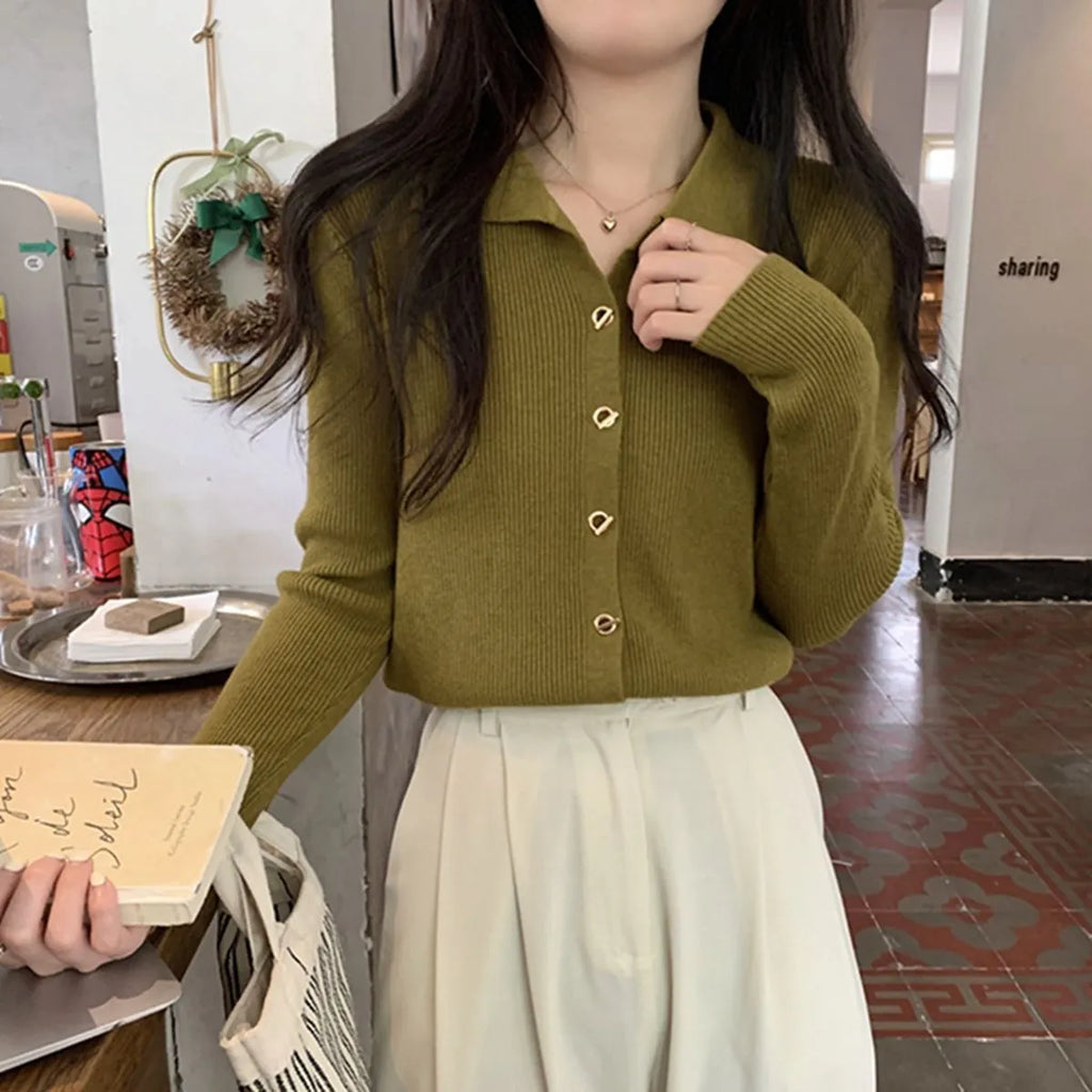 Loose fit beige viscose knitted cardigan with long sleeves, shown worn open.