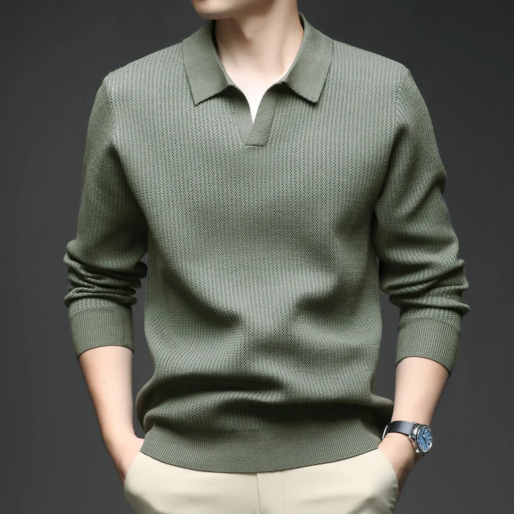 Man wearing a loose-fit green casual pullover sweater for autumn leisure.