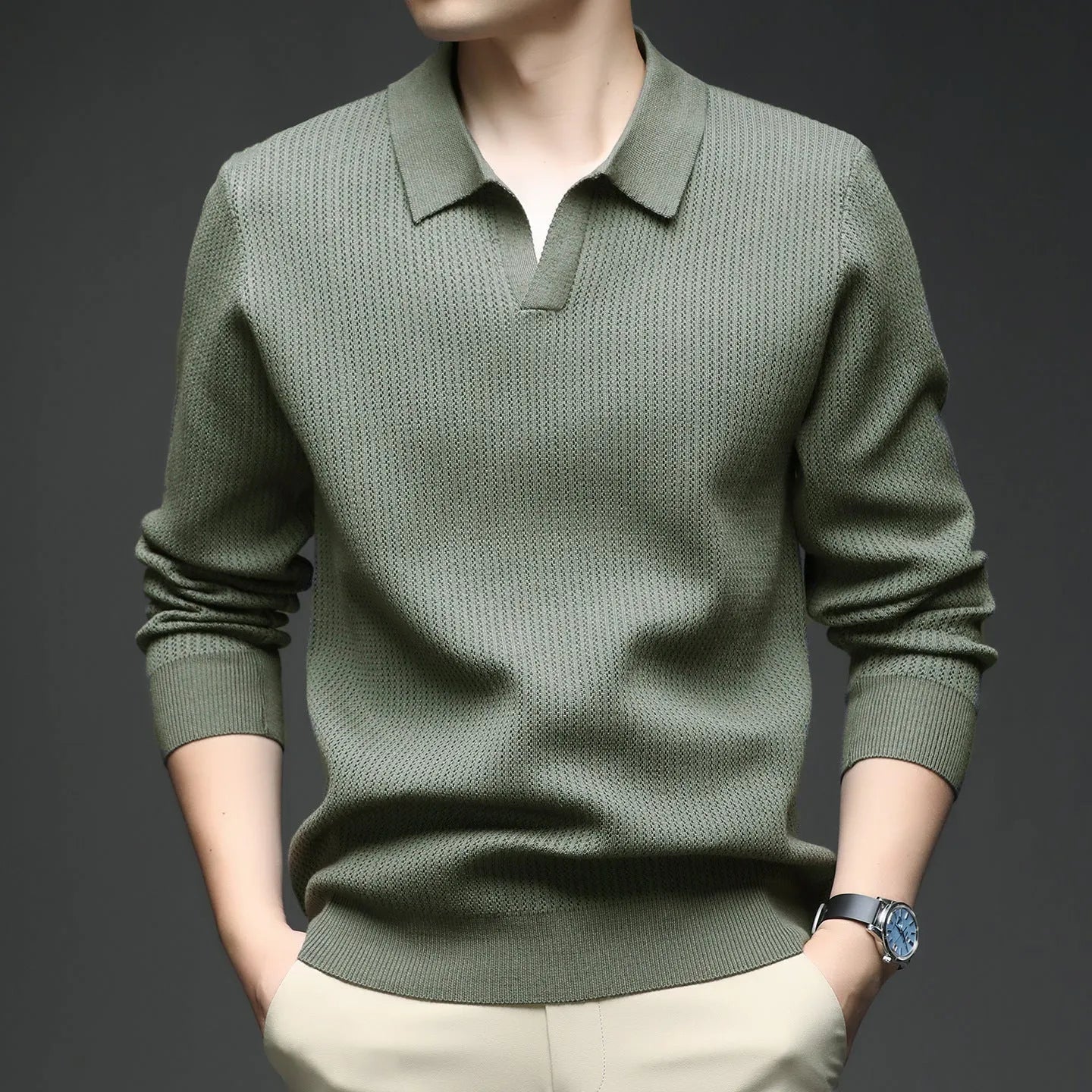 Man wearing a loose-fit green casual pullover sweater for autumn leisure.