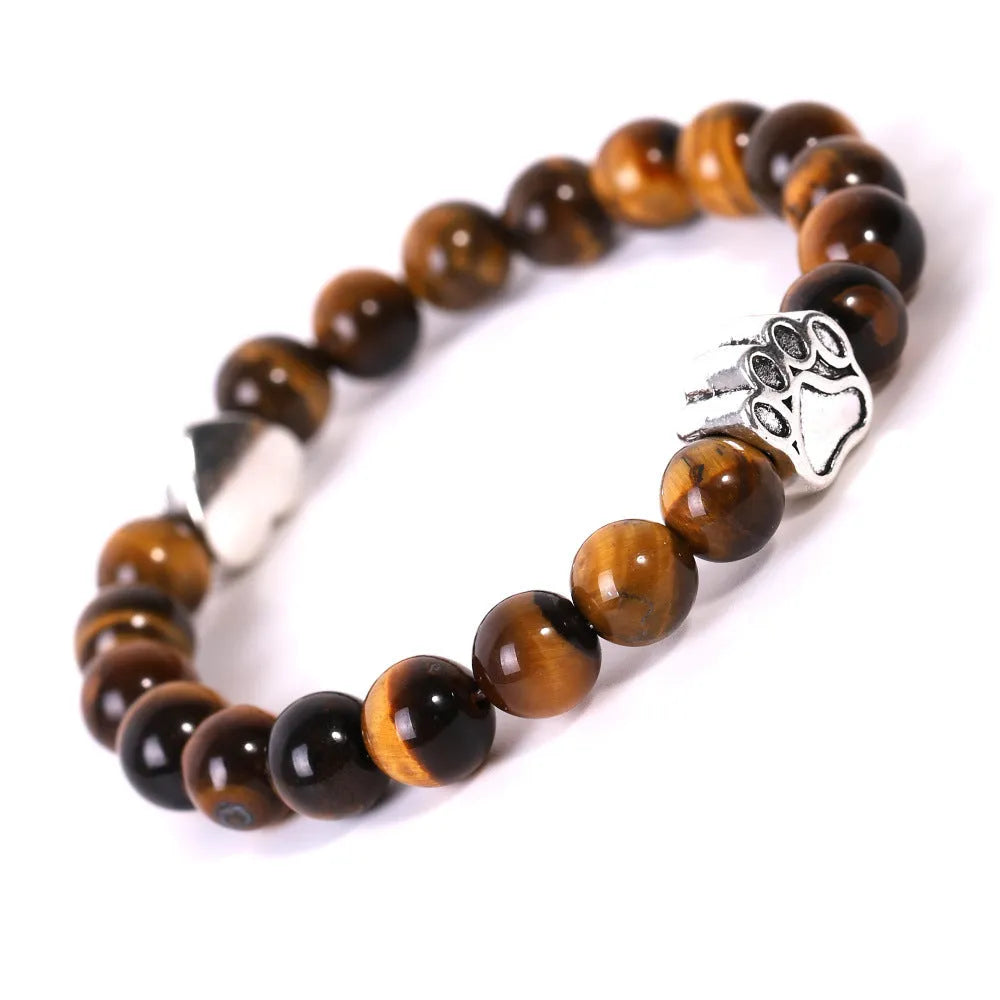 Tigereye Indian Agate stone beaded dog's paw bracelet on wrist, showing geometry shape and round beads.