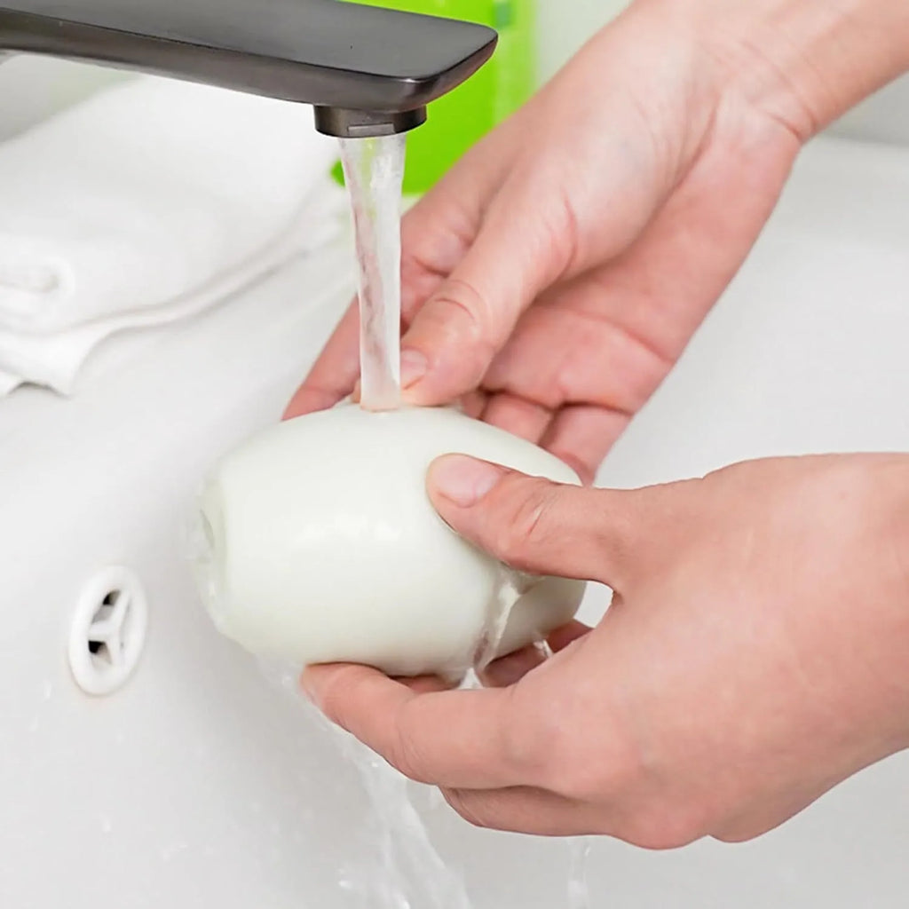 Green and white washable reusable gel lint roller ball for pet hair removal from fabrics