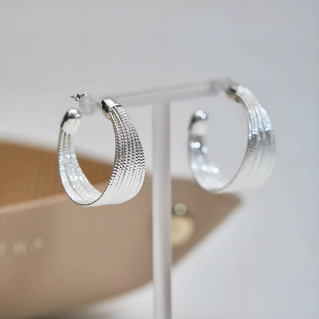 Women's geometric copper bracelet earrings with electroplated silver or gold finish in stud and clip styles