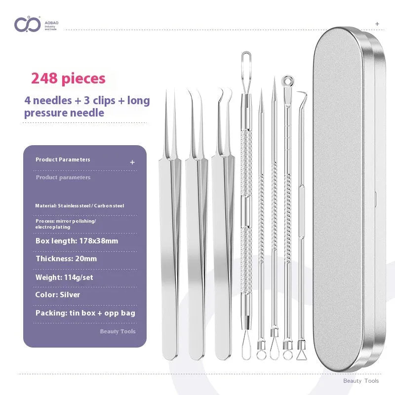 Four silver metal acne needles with pointed tips laid out on a flat surface.