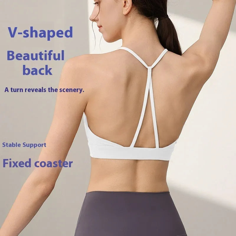 Women's black nylon sports vest with double shoulder straps for running and gym workouts.