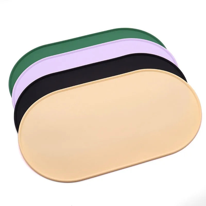 Green silicone waterproof pet feeding placemat with a food bowl on it.