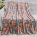 Cartoon print flannel blanket for children shown in two sizes.