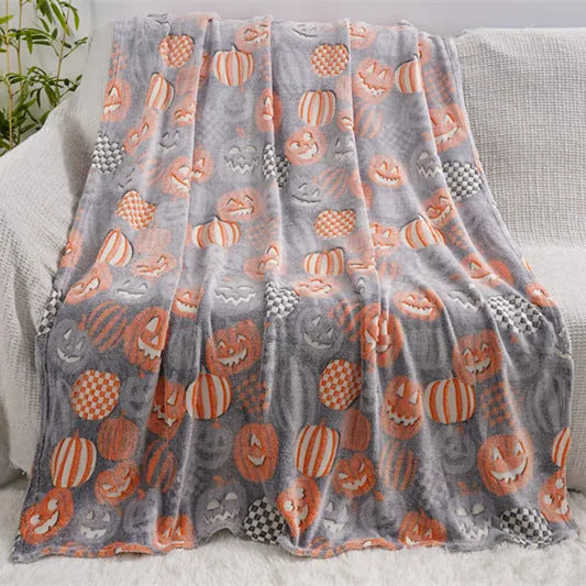 Cartoon print flannel blanket for children shown in two sizes.
