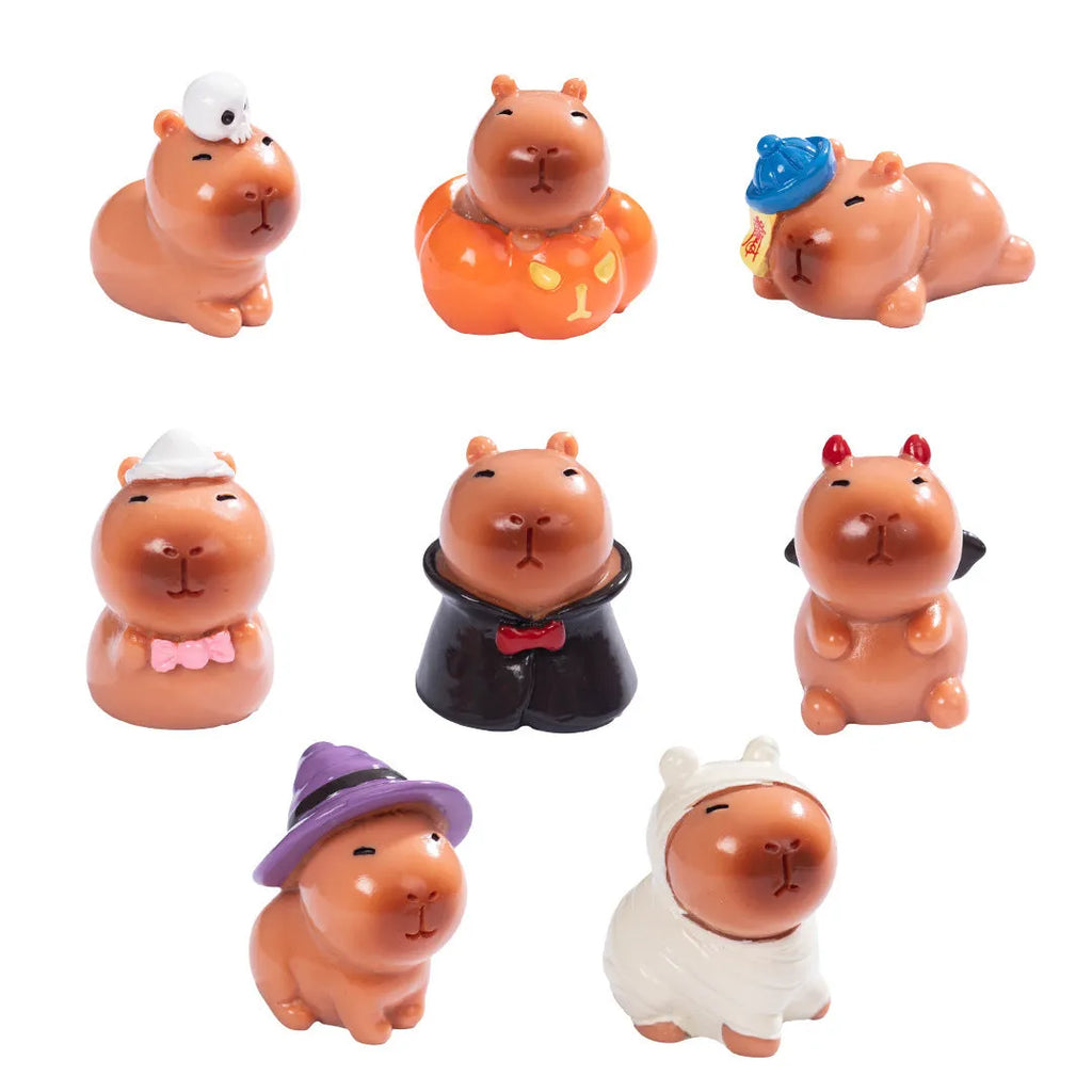 Eight Halloween capybara resin decorations showing pumpkin, zombie, ghost, mummy, vampire, witch hat, devil, and skull designs