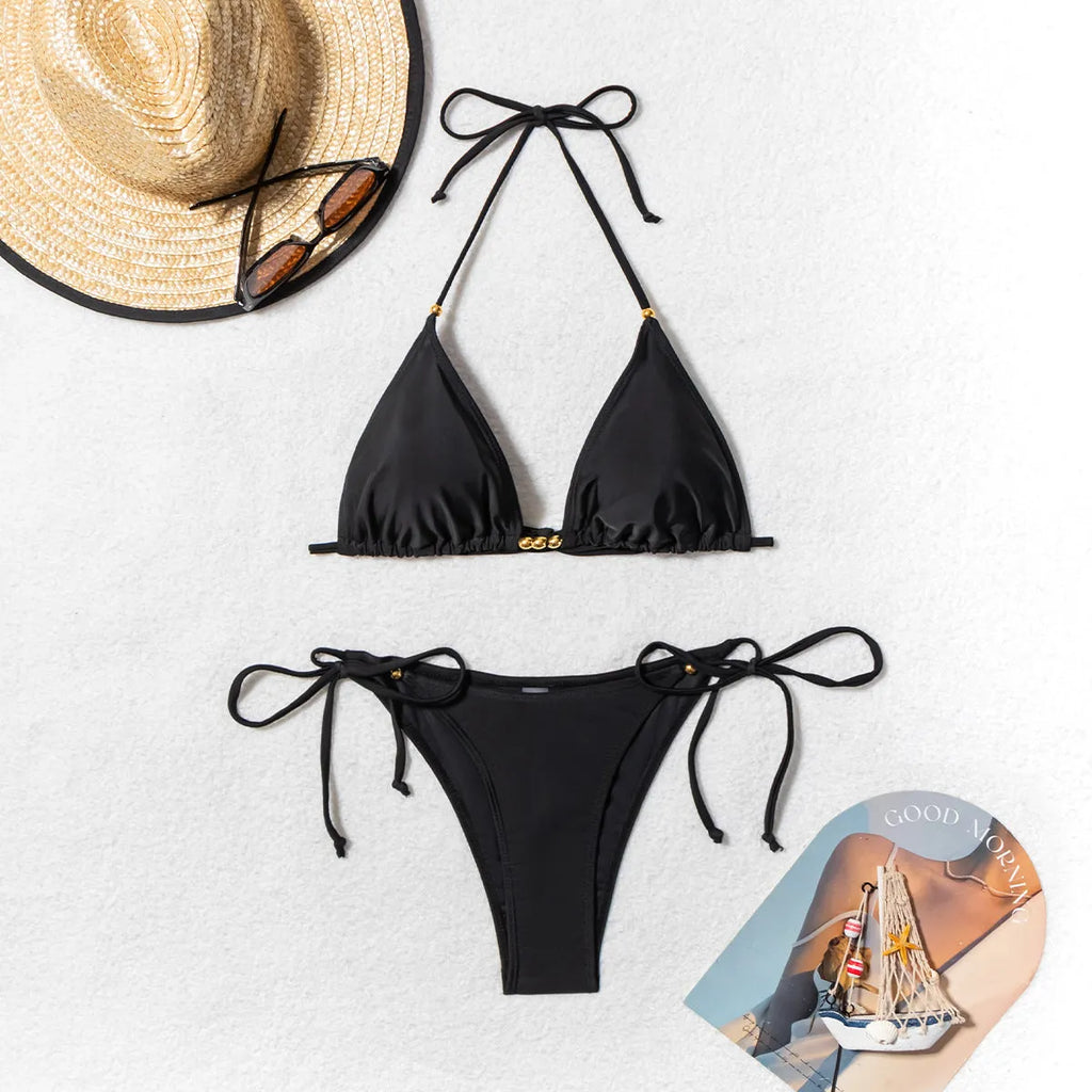 Black women's bikini swimsuit with metal bead detailing and split bottom design