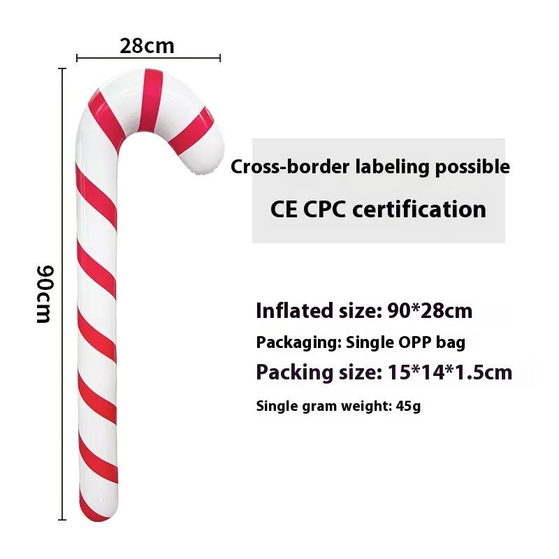 Large red and white inflatable Christmas ball with snowflake design in garden setting