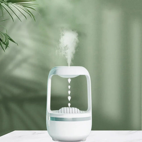 White anti-gravity water droplet humidifier with aromatherapy function on a desk.