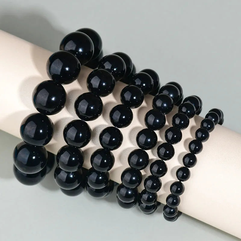 Hand-woven obsidian couple bracelet set with year of birth engraving in ethnic unisex style