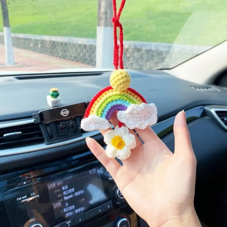Handmade crocheted wool car pendant in avocado, pink rainbow, or red rainbow colours with cartoon styling