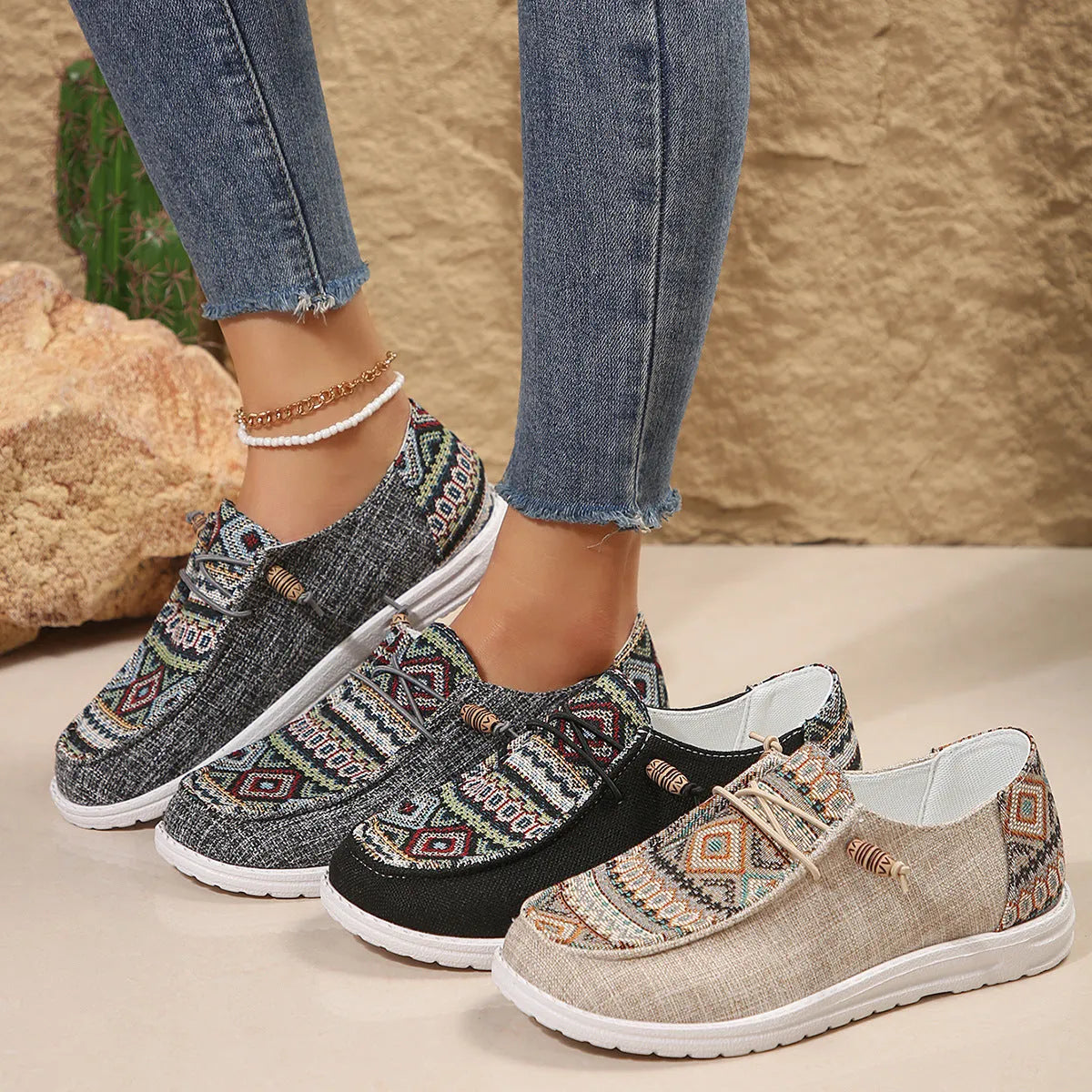 Women's black slip-on flat shoes with round toe and rubber sole on a plain background