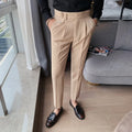 Men's straight leg casual trousers in solid colours including black and grey on a hanger.
