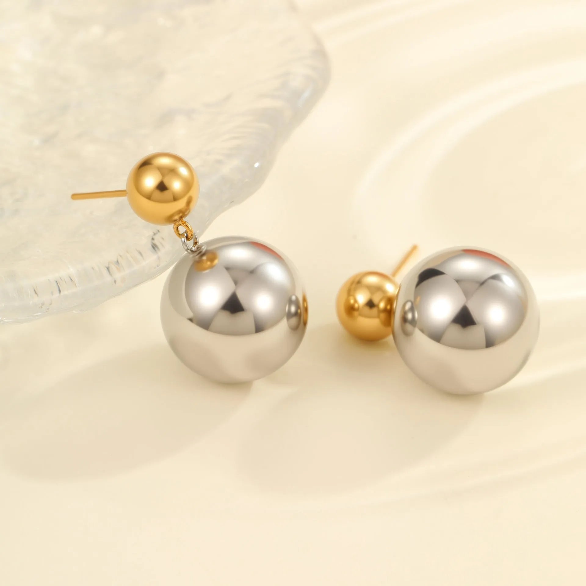 Stainless steel colour-block ear studs with round bead geometry and 18K gold electroplating