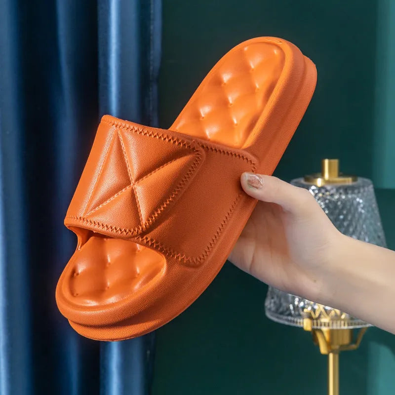 Pair of thick-soled EVA bathroom sandals in a chosen colour, showing moulded non-slip sole design.