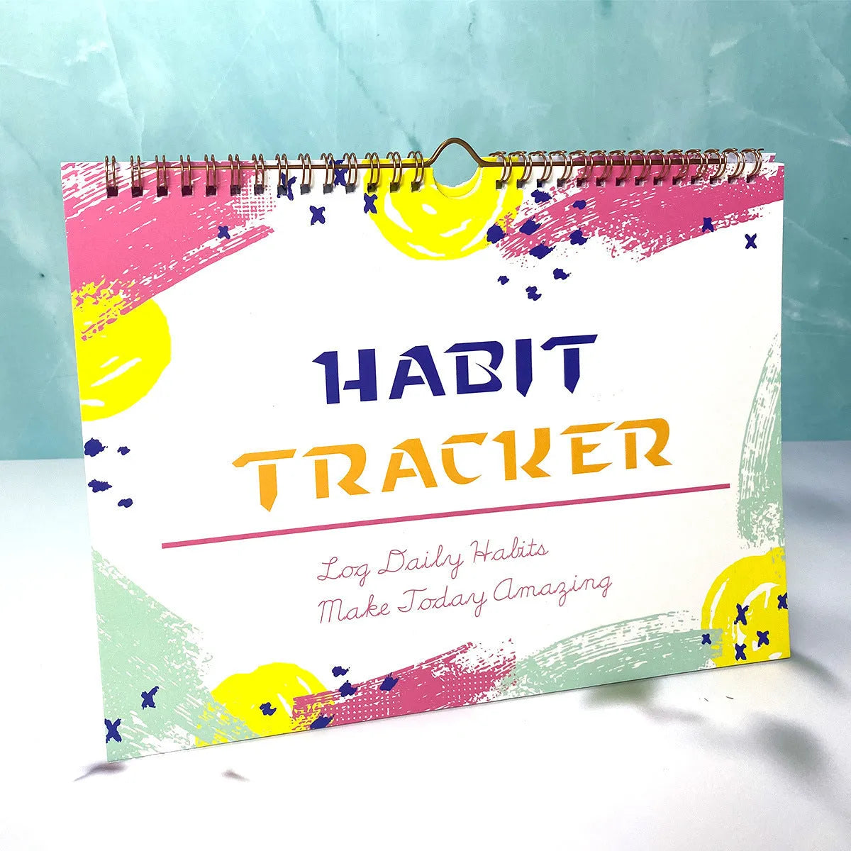 English habit tracking book with 12 pages measuring 21cm by 28cm
