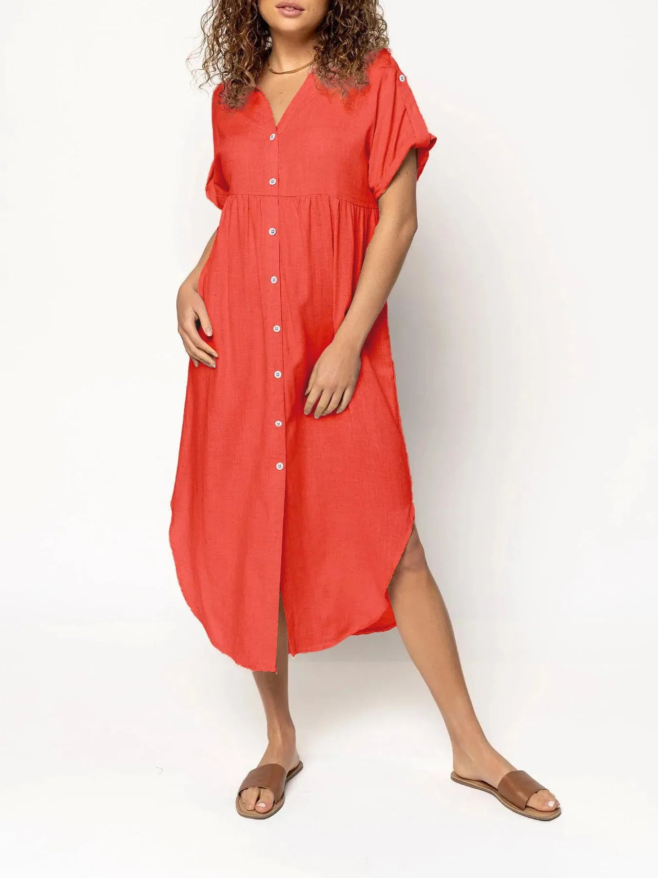 Women's loose-fit mid-length casual dress with button front in a solid colour.