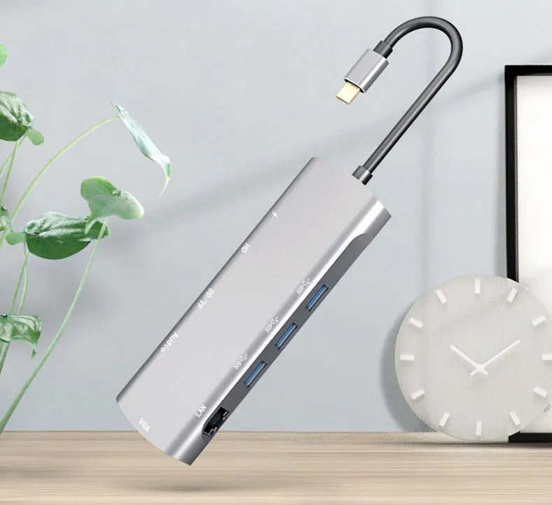 Grey USB-C docking station with HDMI, VGA, USB 3.0 and charging ports