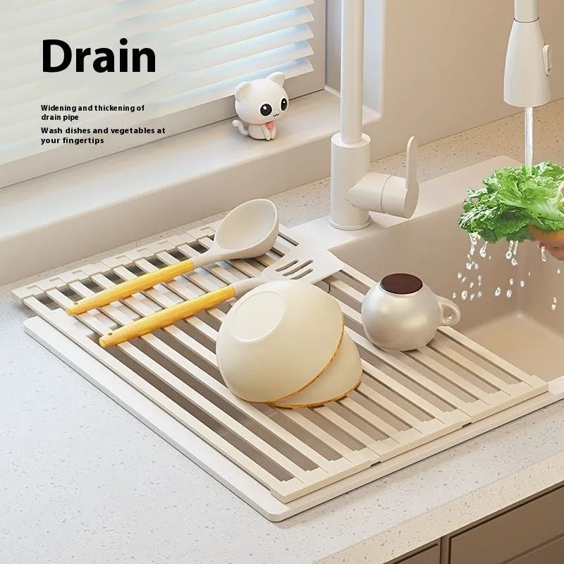 Milky white foldable stainless steel kitchen draining rack for dishes on a countertop