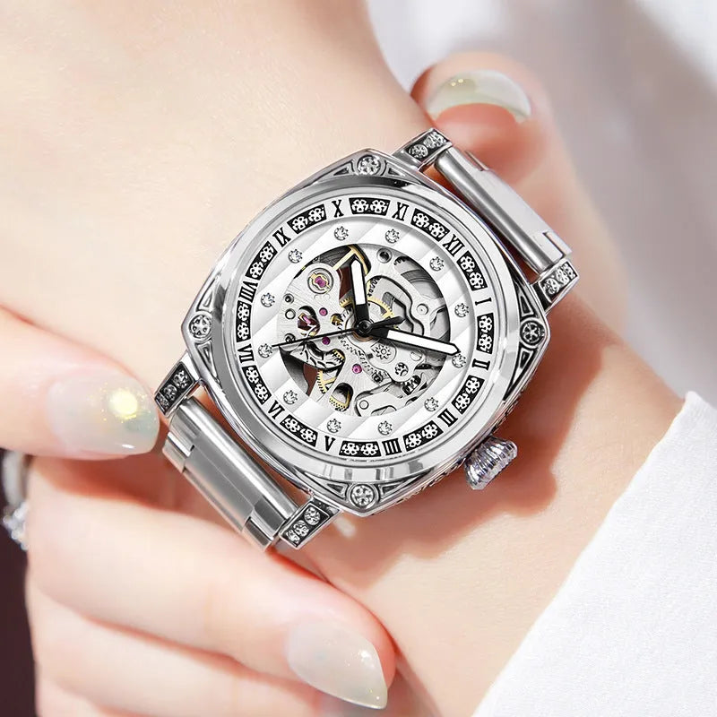 Mechanical watch with luminous hands and leather strap in choice of colours.