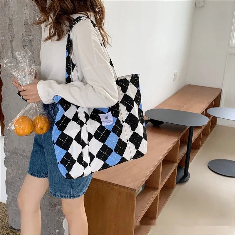 Large capacity oxford cloth women's shoulder bag with a three-dimensional front pocket.