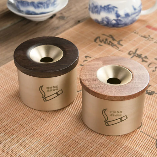 Retro-style brass ashtray with a wooden lid, shown in a home living room setting.