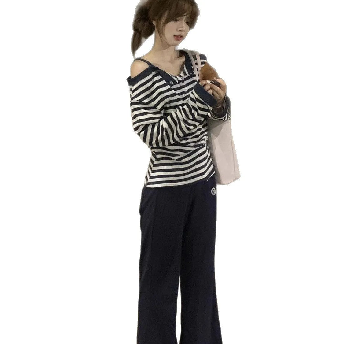 Dark blue Korean-style oversized women's long-sleeved t-shirt with embroidered stripes and button details.