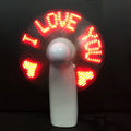 White handheld mini fan with flashing blue and red 'I Love You' LED display