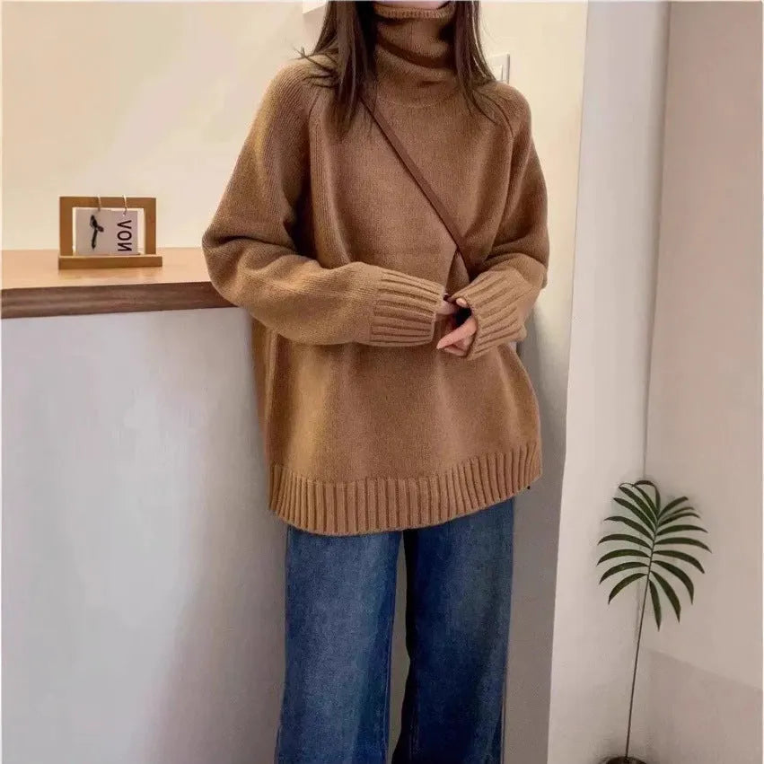 Women's loose-fit turtleneck sweater with thick curling pile collar in black, camel, grey, or red.