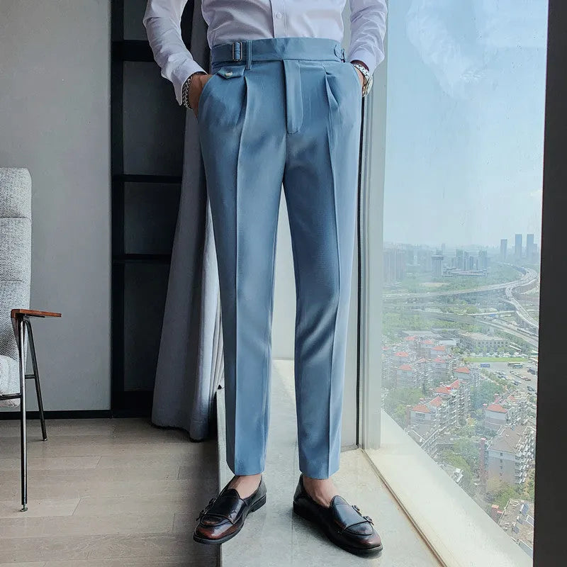 Men's straight leg casual trousers in solid colours including black and grey on a hanger.